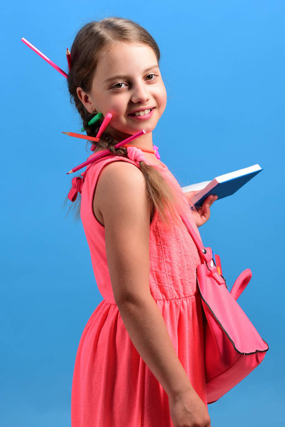 Back to school and education concept. Kid in pink dress - Φωτογραφία, εικόνα