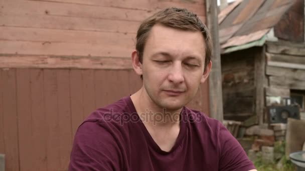 Sad man outdoors in the countryside - Záběry, video