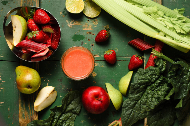 funky fruit and vegetable background with strawberries and rhubarb - Valokuva, kuva