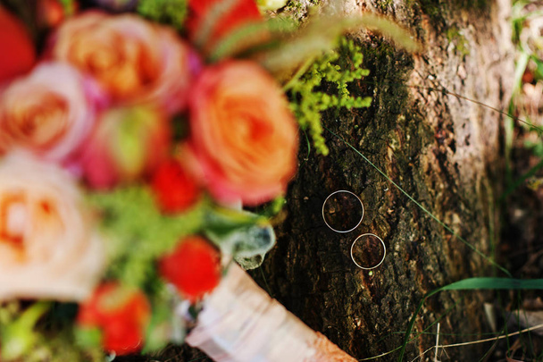Close-up photo of isolated bridal bouquet laying on the ground. - 写真・画像