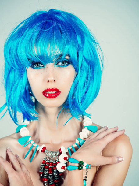 Girl with bright artificial hair in ethnic jewelry. - Valokuva, kuva