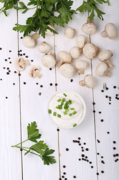 fresh mushrooms and greens on a white background - Zdjęcie, obraz