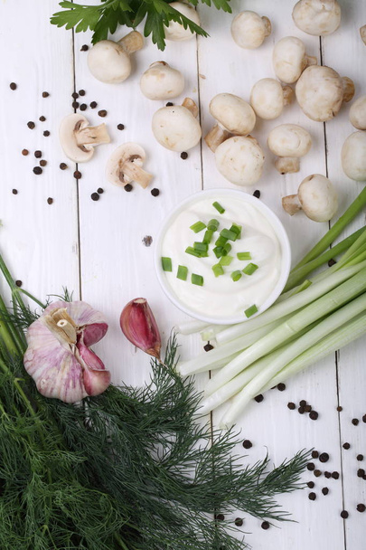 fresh mushrooms and greens on a white background - Fotó, kép
