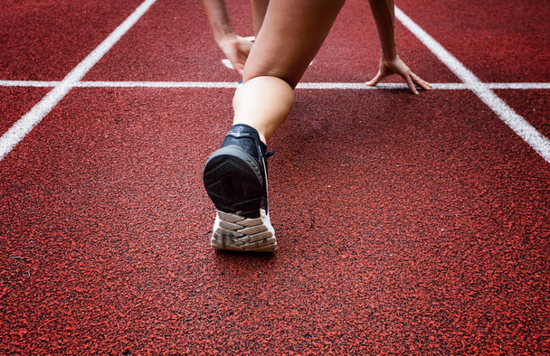 Runner feet running on racetrack closeup on shoe.  - Foto, imagen