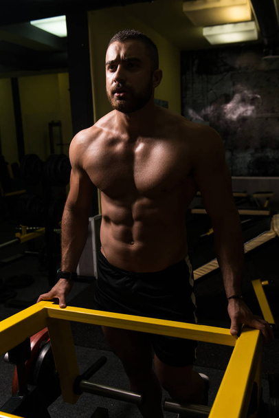 Muscular Man After Exercise Resting In Gym - Fotoğraf, Görsel