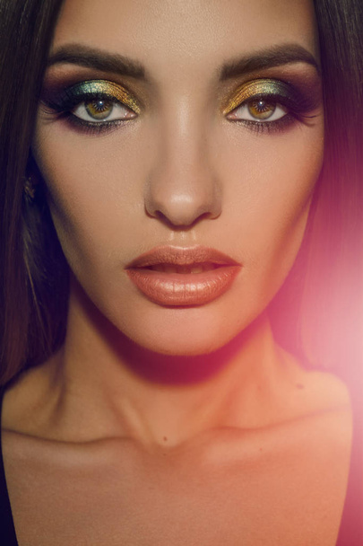 Close up of beauty woman with multicolor make up looking at the camera - Valokuva, kuva