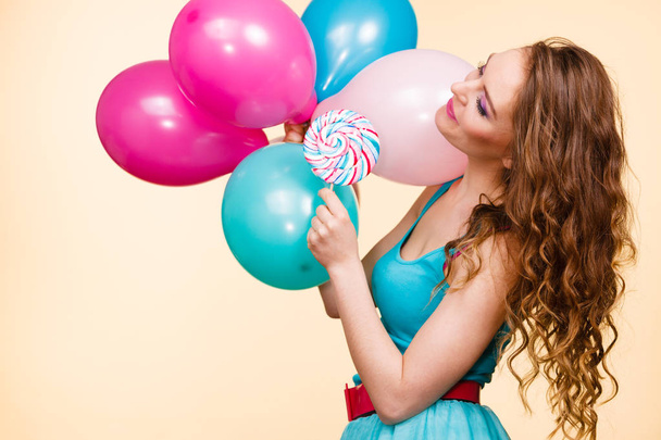 Woman with colorful balloons and lollipop - Фото, зображення