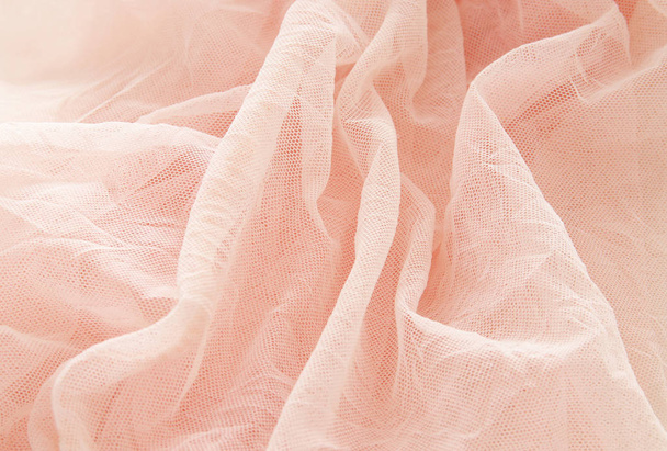 Vintage tulle pink chiffon dress on wooden white table. Wedding and girl's party concept - Φωτογραφία, εικόνα