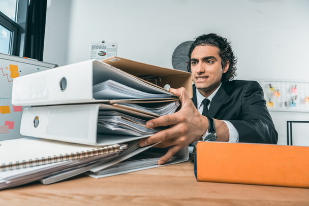 businessman doing paperwork at workplace - Zdjęcie, obraz