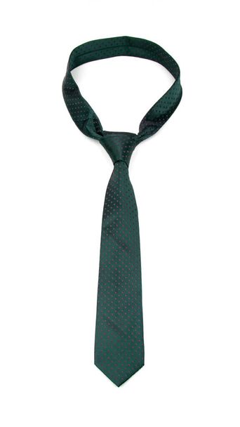 stylish tied dark green tie with dots isolated on white background - Photo, Image