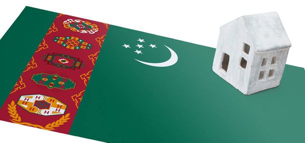 Pequeña casa en una bandera - Turkmenistán
 - Foto, Imagen