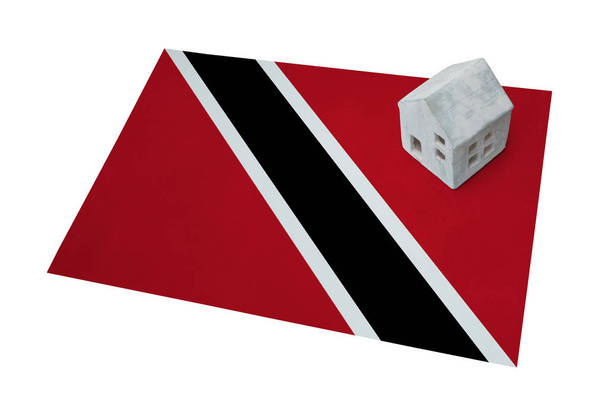 Pequeña casa en una bandera - Trinidad y Tobago
 - Foto, Imagen