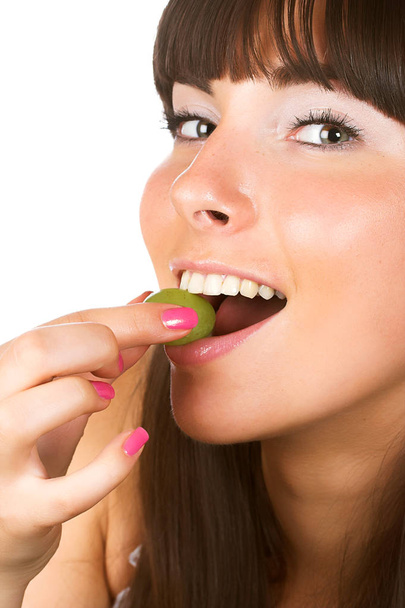 Beautiful young woman with green grape - Photo, image