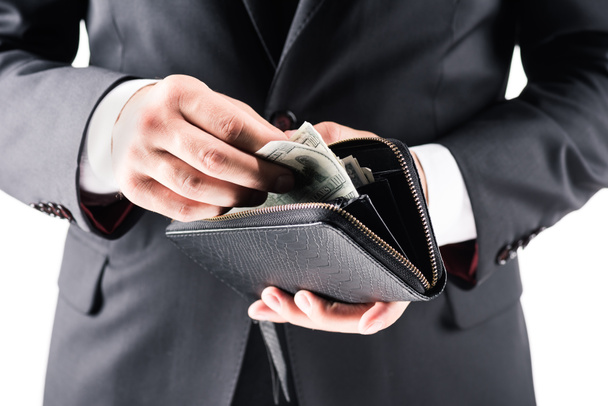 бізнесмен тримає гаманець з доларами
 - Фото, зображення