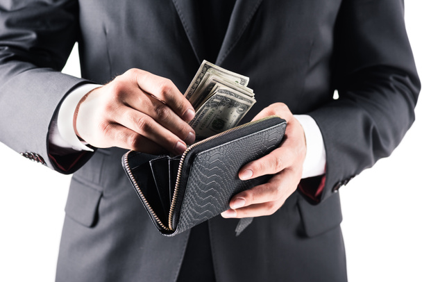 businessman holding wallet with dollars - 写真・画像