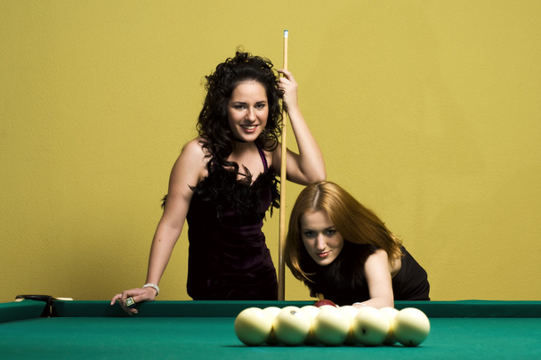 Two girls are playing billiards - Foto, Imagem