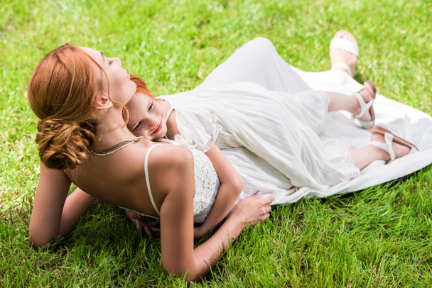 mother and daughter hugging at park - Valokuva, kuva