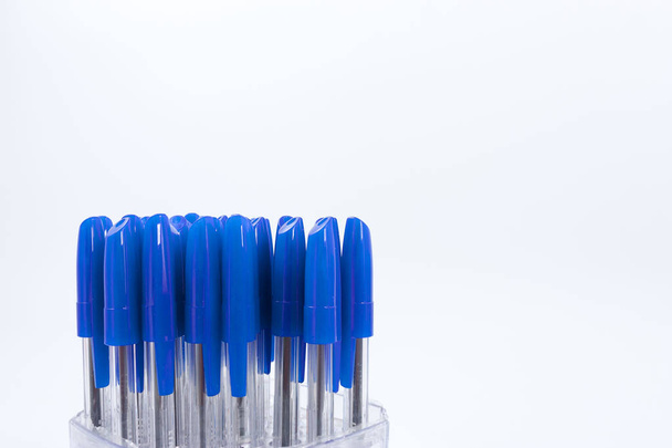 A lot of ballpoint pens on a white background. - 写真・画像