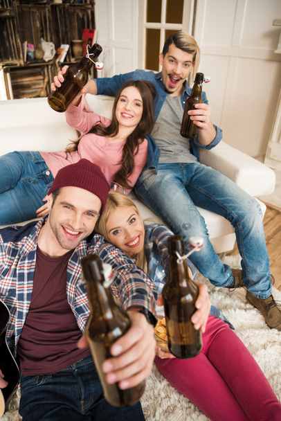 Happy young friends with beer bottles - Foto, Imagem