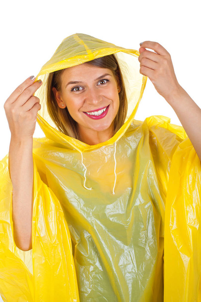 Attractive woman wearing yellow raincoat - isolated - Foto, Imagem