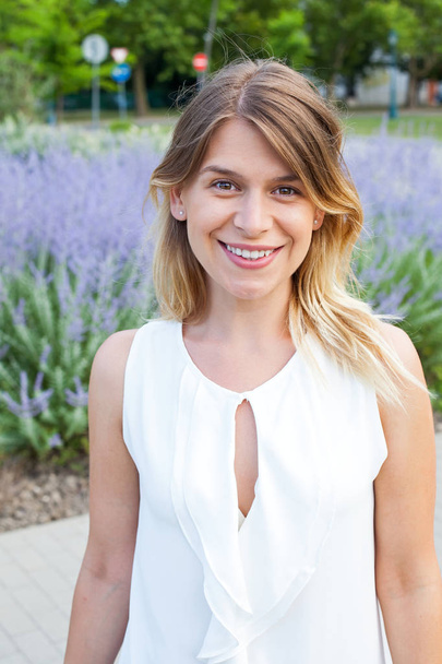 Smiling woman in front of blooming lavender - Photo, image