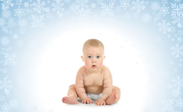 Sitting small baby on blue background - Foto, Imagen