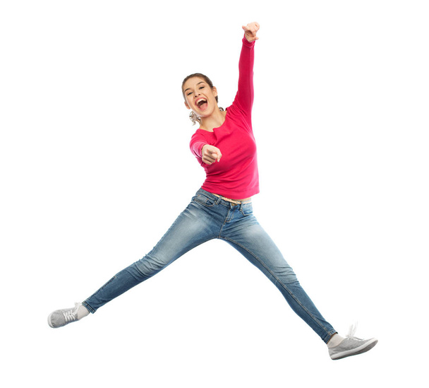 smiling young woman jumping in air - Φωτογραφία, εικόνα