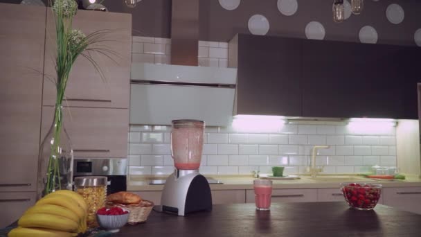 Brunette drinks juice in flat. - Footage, Video