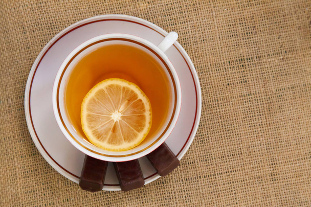 Cup of black tea and bagel - Valokuva, kuva