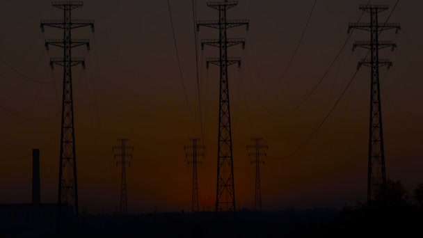 High-voltage power lines at sunrise. - Footage, Video