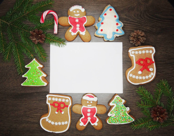 christmas cookies greeting card and decoration on wooden backgro - Valokuva, kuva
