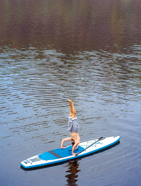 SUP Bearded man yoga meditation 11 - Фото, изображение