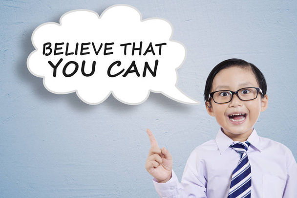 Male child saying Believe That You Can - 写真・画像