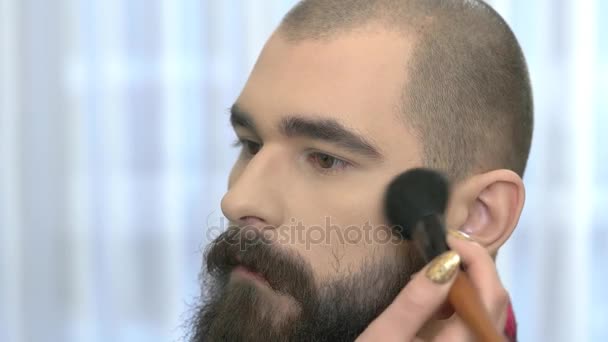 Brush applying makeup, male model. - Footage, Video