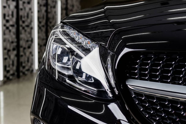 Car detailing series: Clean black car headlights - Photo, Image
