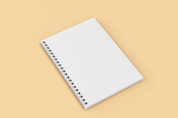 Closed notebook spiral bound on orange background - Foto, immagini