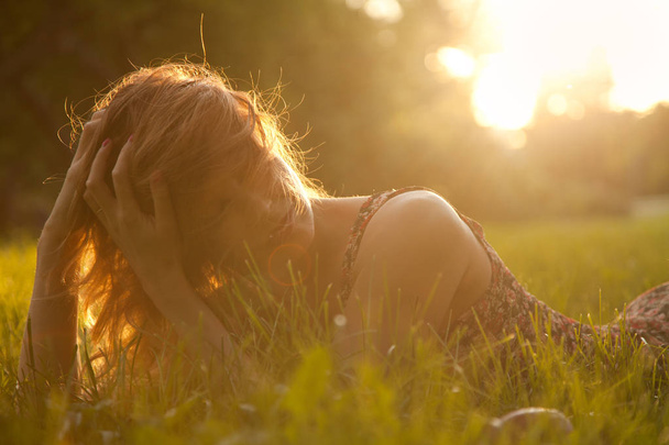 Trendy Hipster Slim Girl Relaxing on the Grass In The Summer SunSet Park - Photo, Image