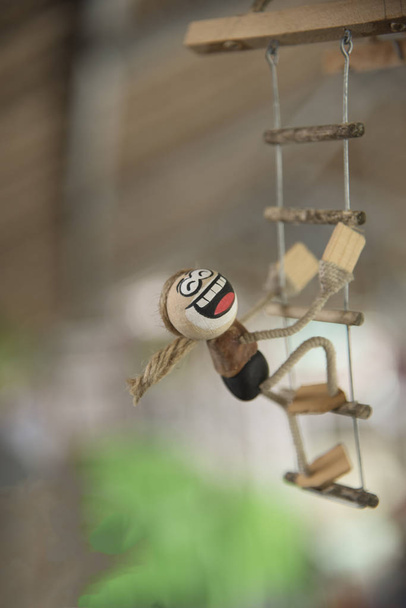 Кокосовая кукла для мобильного повешения
 - Фото, изображение