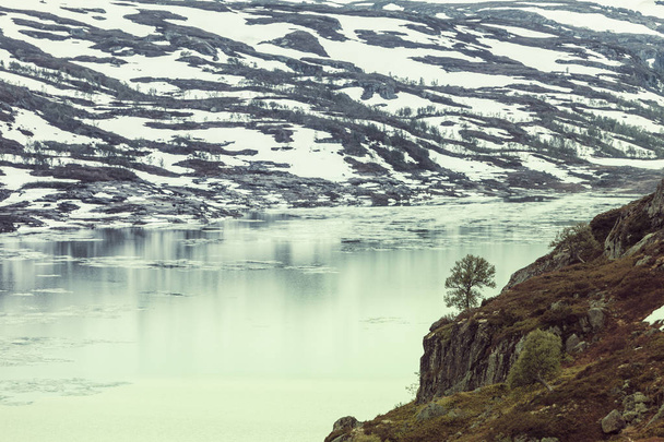 Norway scenic mountains with frozen lake. - 写真・画像