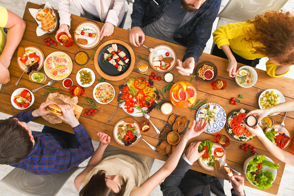 People eat healthy meals at served table dinner party - Photo, Image