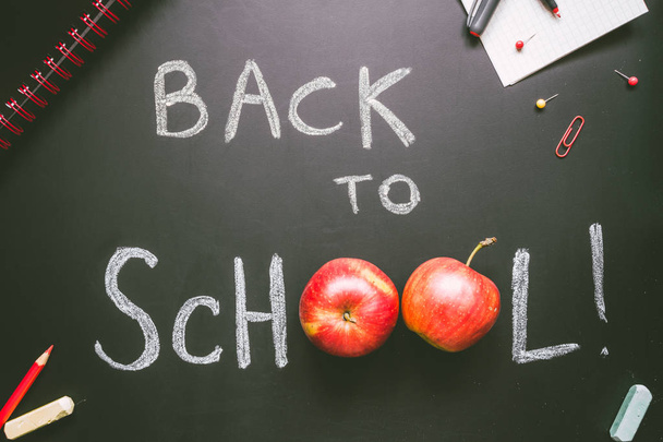 Back to school. School supplies on the blackboard background, education concept - Photo, image
