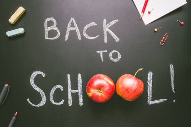 Back to school. School supplies on the chalkboard background, education concept - Photo, image