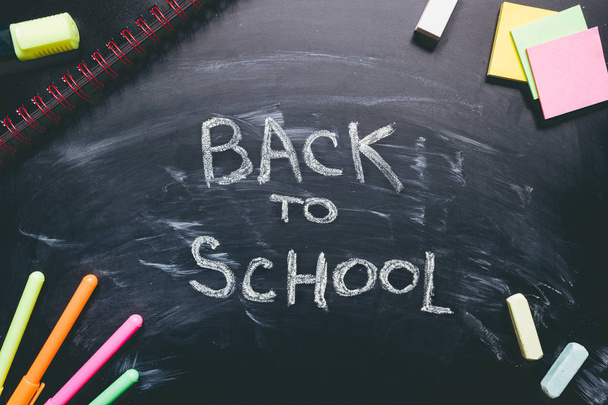 Back to school. School supplies on the chalkboard background, education concept - Foto, Imagem