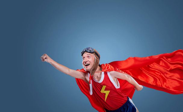 A funny superhero flies - Foto, Bild