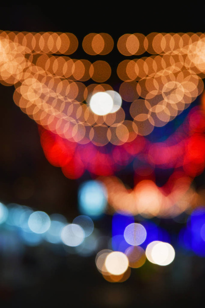 Defocused bokeh lights in blur night background - Фото, зображення