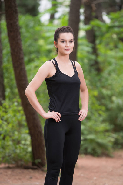 Portrait of a Fitness Woman Jogging Outdoors - Foto, afbeelding