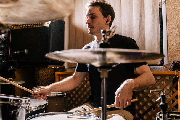 Drummer rehearsing on drums before rock concert - Foto, Bild