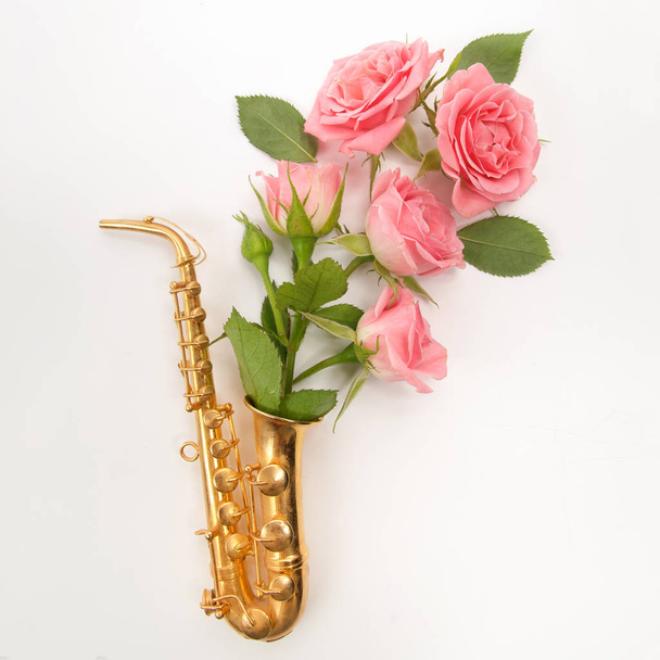 Jazz Day. Saxophone with flowers. Flat lay, top view - Foto, immagini