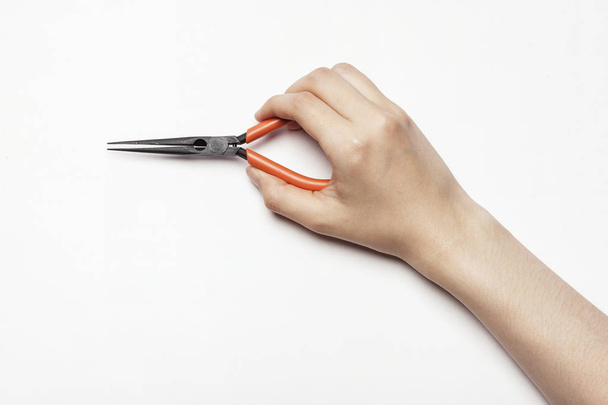 hand hold a needle-nose pliers - Fotoğraf, Görsel