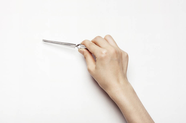 hand hold a tweezers - Foto, Bild